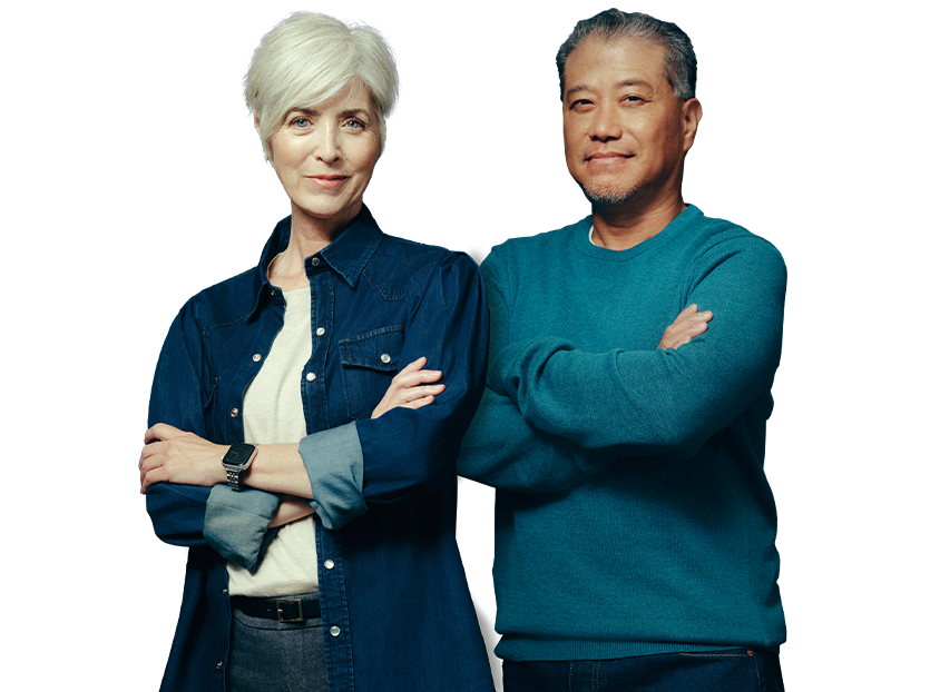 Middle-aged man and woman standing next to each other. Each with their arms folded across their chest. Not actual patients